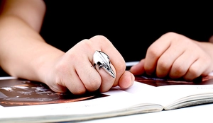 Detailed view of punk style silver raven skull ring crafted from high-quality stainless steel