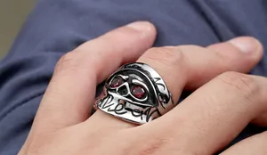 Gothic skull ring for men with red gemstone eyes and vintage engraved detailing