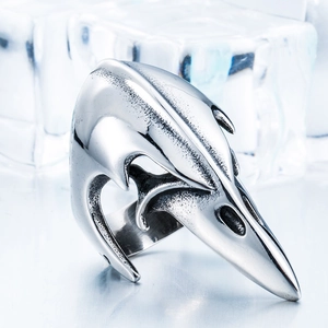 Viking stainless steel crow skull ring with vintage finish on cold ice background