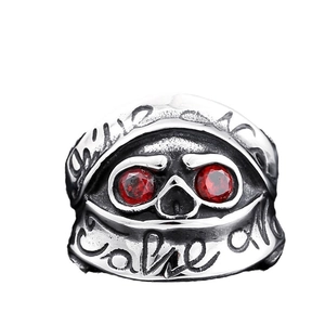 Men's punk skull ring with red gems and Give No Take All engraving on vintage silver band