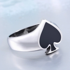 Polished stainless steel ring with black spade design for men and women on a mirror base