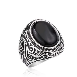 Vintage titanium steel men's ring with oval black onyx gemstone and engraved scroll patterns