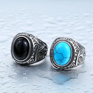 Vintage titanium steel rings for men featuring engraved floral patterns and oval gemstones