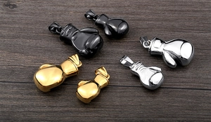 Detailed comparison of boxing glove pendants in gold, silver, and black finish