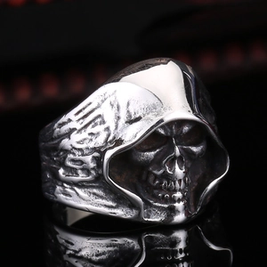 Macro detail of gothic grim reaper skull ring with vintage silver finish and carvings