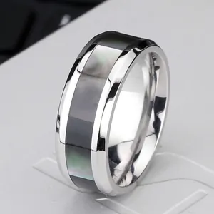 Polished stainless steel men's wide ring featuring a sleek black mother of pearl inlay