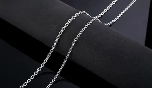 Detailed close-up of polished stainless steel O-chain links on a black background