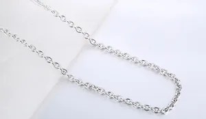 Close-up of polished stainless steel O-chain link necklace with mirror finish