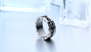 Detailed macro view of vintage engraved stainless steel ring with elegant pattern