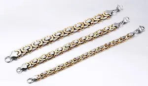 Three widths of two-tone gold and silver Byzantine chain bracelets with lobster clasps