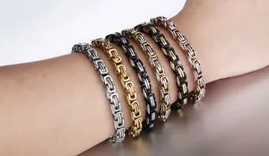 Close-up of Byzantine weave bracelets in silver, gold, and two-tone stainless steel