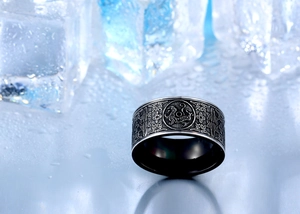 Macro shot of ethnic dragon totem engraving on black titanium steel ring for men