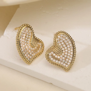 18K gold plated heart stud earrings with zircons and milgrain edge in a 45-degree view