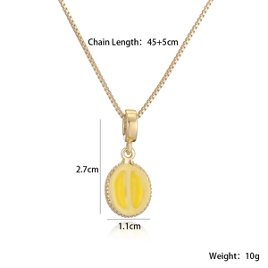 Detailed view of the 18K gold plated necklace with a yellow enamel geometric fruit pendant