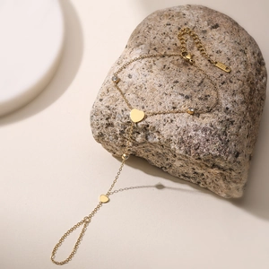 Minimalist 18K gold plated stainless steel slave bracelet with heart and zircon details
