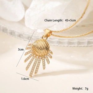 Macro shot of gold sunburst pendant with zircon inlay and 45+5cm adjustable chain