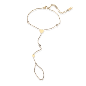 Detail of 18K gold-plated stainless steel hand chain featuring heart charms and rhinestones
