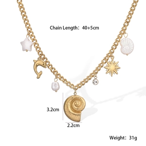 Detailed view of a gold chain necklace featuring seashell, star, and pearl charms