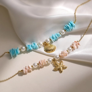 Elegant gold necklaces with ocean shells, colorful stones and sea star charms on silk