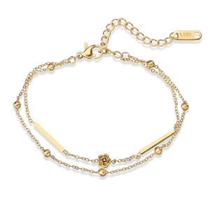 Detail view of double-layer gold stainless steel bracelet with rose charm and round beads