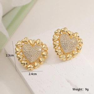 Macro shot of gold-plated heart earrings with white zircon inlay and 2.4cm size specs