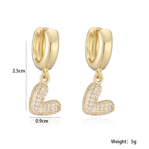 Detail view of 18K gold plated hoop earrings with micro-paved zircon heart charms