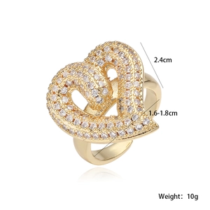 Macro shot of gold-plated double heart ring with dimensions 2.4cm and weight 10g