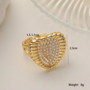 Detail view of 18K gold plated heart ring with micro-pave zircons and ribbed texture