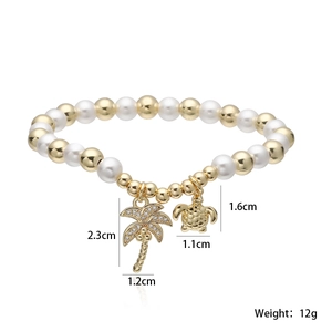 Detail of pearl bracelet with gold palm tree and turtle charms showing dimensions