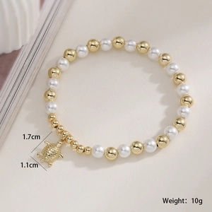 Detail of beaded pearl bracelet with gold turtle charm and dimension annotations
