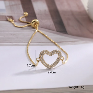 Detail view of gold heart bracelet with zircon pavé setting and sizing measurements