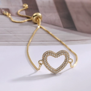 Elegant gold heart bracelet with sparkling zircons and adjustable box chain for women