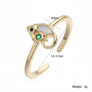 Detail view of 18K gold plated ring with green gemstone and mother of pearl inlay