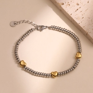 Beaded stainless steel bracelet with golden heart charms and adjustable lobster clasp