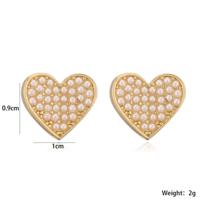 Detailed size view of gold-plated heart stud earrings with white pearls, 1cm x 0.9cm size