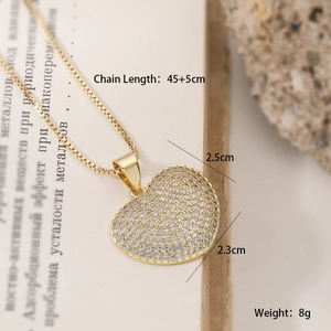 Detail view of gold heart pendant necklace with dimensions 2.5cm by 2.3cm and box chain