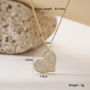 Detailed view of gold plated heart pendant with pavé cubic zirconia and size dimensions