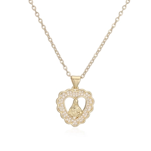 Detail of 18K gold heart pendant with Virgin Mary relief and cubic zirconia stones