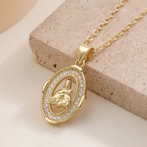 Vintage 18K gold plated oval necklace featuring a Virgin Mary pendant with sparkling zircons