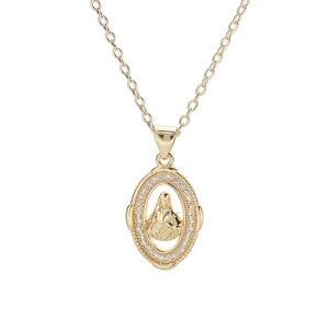Macro detail of 18K gold plated Mary pendant with cubic zirconia and O-chain links