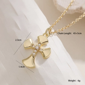 Detail of 18K gold plated cross pendant necklace with zircon and dimensions 2.3cm x 1.4cm