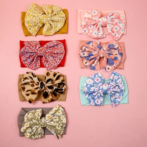 Set of 7 colorful leopard and floral print oversized bow nylon headbands for baby girls