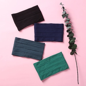 Close-up of jacquard knit nylon baby headbands showing soft texture and cable pattern