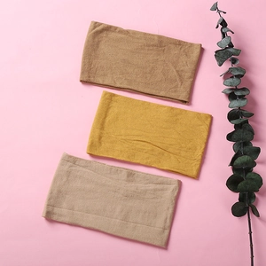 Three-piece set of soft nylon headbands for babies in earthy brown and mustard yellow tones