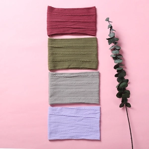 Detailed close-up showing soft jacquard nylon baby headbands in multiple warm colors