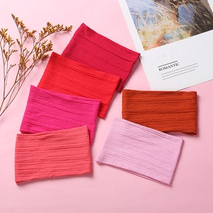 Set of 6 soft jacquard nylon baby headbands in red and pink tones for infants