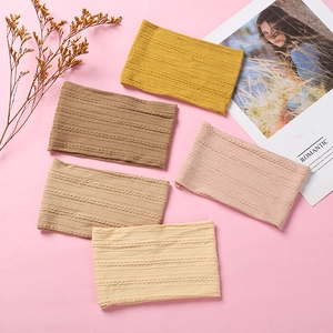 Detail view of five assorted jacquard nylon baby headbands with knitted twist patterns