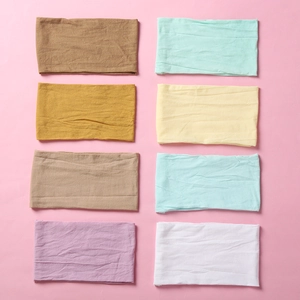 Detailed set of 8 colorful stretchy nylon baby headbands with soft vertical rib texture