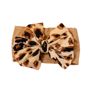 Elastic baby headband with large leopard print bow made of soft wide nylon fabric