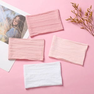 Detailed close-up of soft jacquard nylon baby headbands in pink and white knit textures